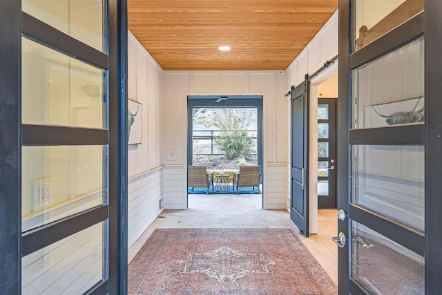 19217 Lost Tree Cv, Spicewood, TX 78669 - doorway to outside with wood ceiling, a barn door, and recessed lighting