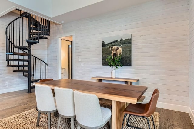 19217 Lost Tree Cv, Spicewood, TX 78669 - dining area with wood finished floors, wooden walls, and stairs