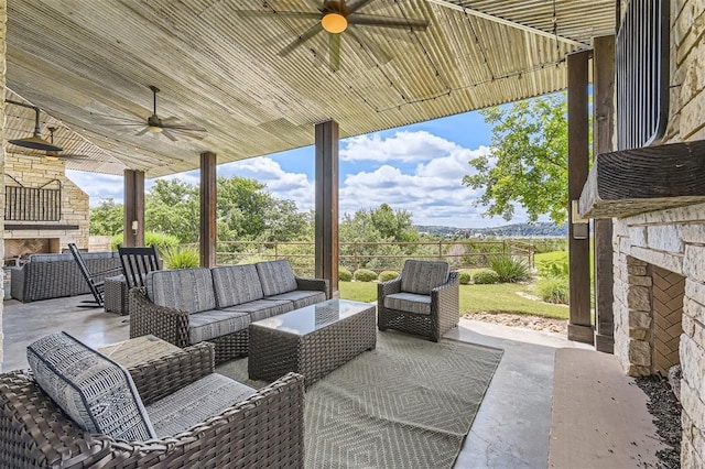 19217 Lost Tree Cv, Spicewood, TX 78669 - view of patio featuring a ceiling fan and an outdoor living space with a fireplace
