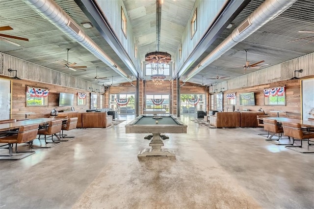 19217 Lost Tree Cv, Spicewood, TX 78669 - misc room with pool table, a ceiling fan, wooden walls, finished concrete floors, and high vaulted ceiling