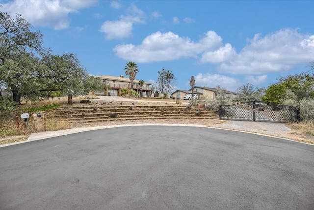 view of road featuring a gate