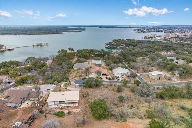 drone / aerial view with a water view and a residential view