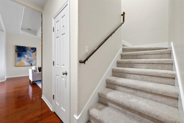 staircase featuring hardwood / wood-style flooring