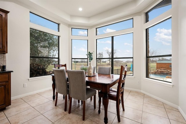 dining area with light tile patterned flooring