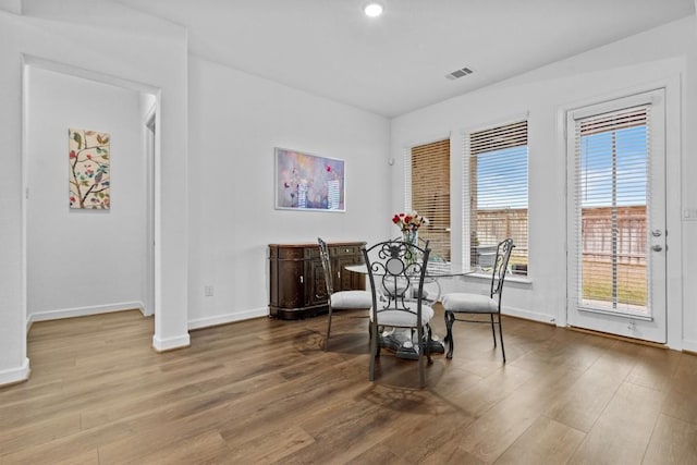 872 Wild Pecan Loop, Buda, TX 78610 - dining space with baseboards, wood finished floors, healthy amount of natural light, and recessed lighting