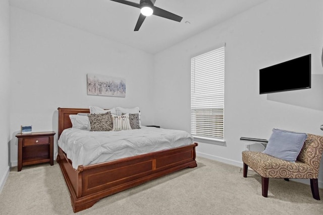 872 Wild Pecan Loop, Buda, TX 78610 - bedroom with light carpet, baseboards, and multiple windows