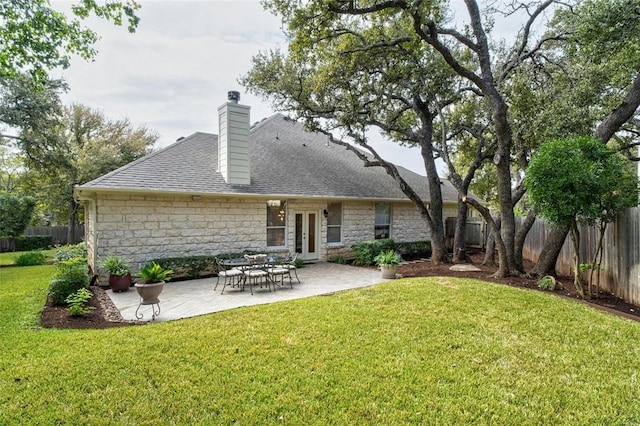 11409 Cezanne Ct, Austin, TX 78726 - rear view of property featuring stone siding, french doors, a chimney, and a shingled roof