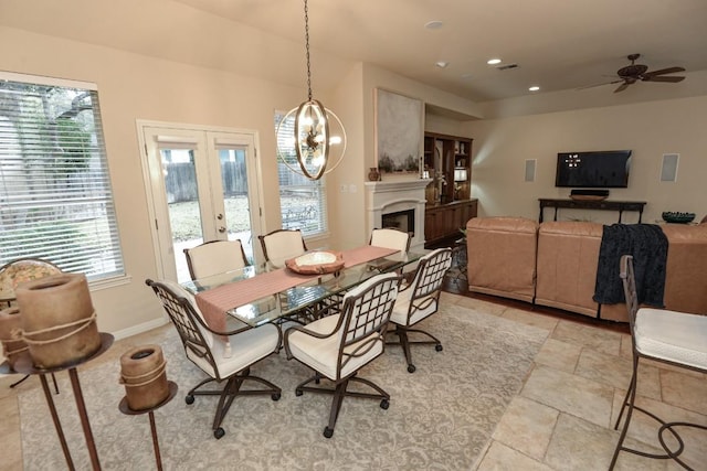 11409 Cezanne Ct, Austin, TX 78726 - dining space featuring french doors, a fireplace, ceiling fan, and recessed lighting