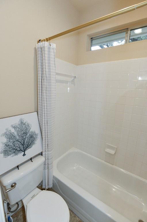 11409 Cezanne Ct, Austin, TX 78726 - bathroom with toilet and shower / bathtub combination with curtain
