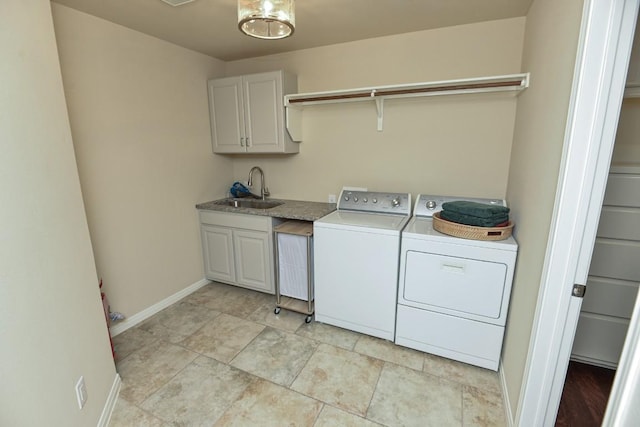 11409 Cezanne Ct, Austin, TX 78726 - laundry room with separate washer and dryer, cabinet space, and baseboards