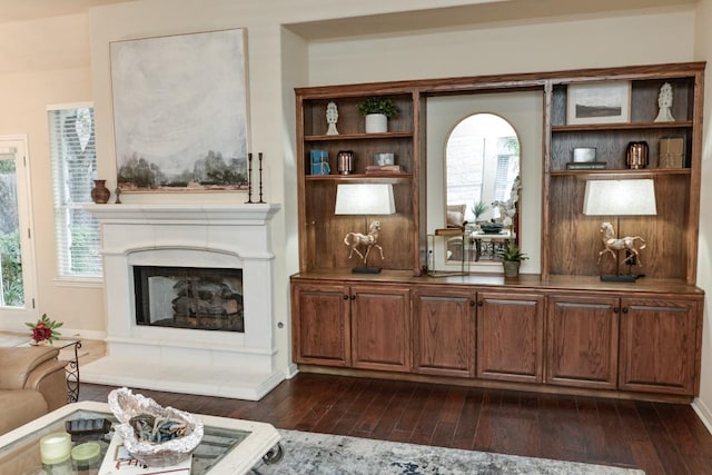 11409 Cezanne Ct, Austin, TX 78726 - living room with dark wood-style floors and a fireplace with raised hearth