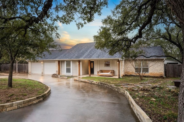 ranch-style house featuring a garage