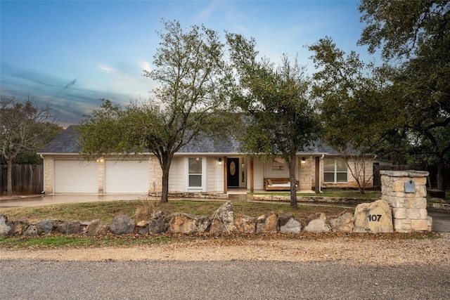 single story home featuring a garage