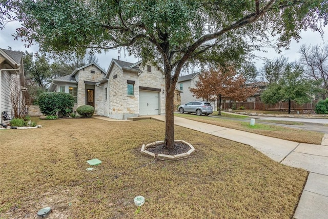 view of front of home featuring a garage and a front yard