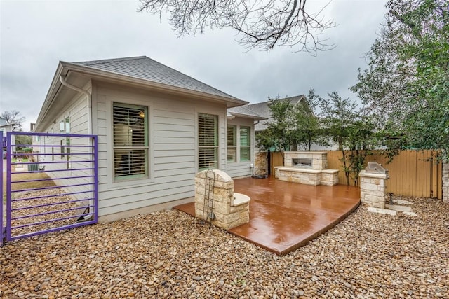 rear view of property featuring an outdoor kitchen