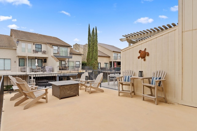 view of patio with a fire pit