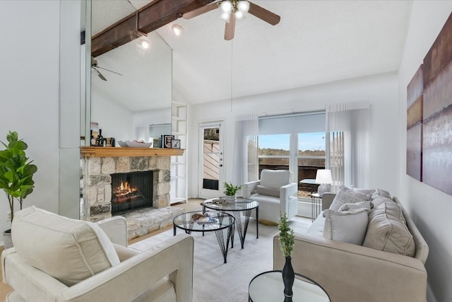 carpeted living room with beam ceiling, a fireplace, high vaulted ceiling, and ceiling fan