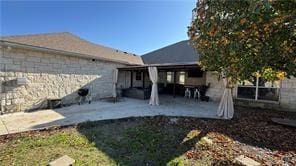 rear view of property with a patio