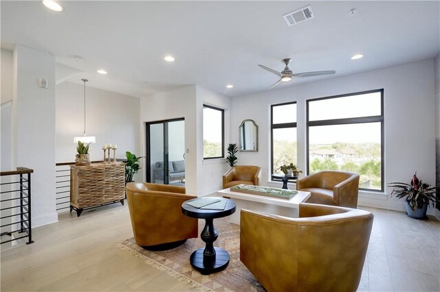 2050 Lohmans Spur Rd Unit 102, Lakeway, TX 78734 - living area featuring light wood-style flooring, a ceiling fan, and recessed lighting