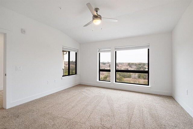 2050 Lohmans Spur Rd Unit 102, Lakeway, TX 78734 - spare room with light carpet, vaulted ceiling, and a ceiling fan