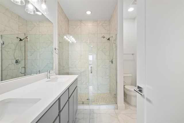 2050 Lohmans Spur Rd Unit 102, Lakeway, TX 78734 - bathroom featuring marble look tile flooring, a shower stall, double vanity, and recessed lighting