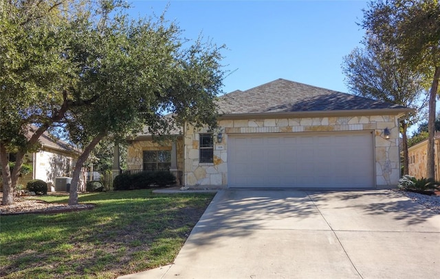 ranch-style house featuring stone siding, a front lawn, concrete driveway, and an attached garage