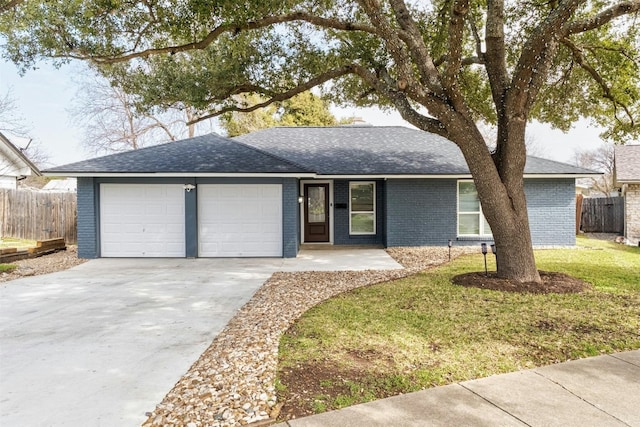 ranch-style home featuring brick siding, an attached garage, fence, and driveway
