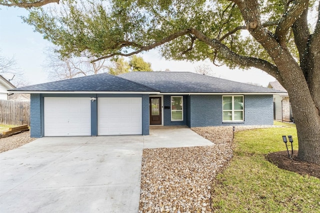 single story home with a garage and a front yard