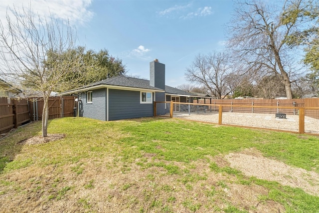 10113 Quail Hutch Dr, Austin, TX 78758 - rear view of property with a chimney and brick siding
