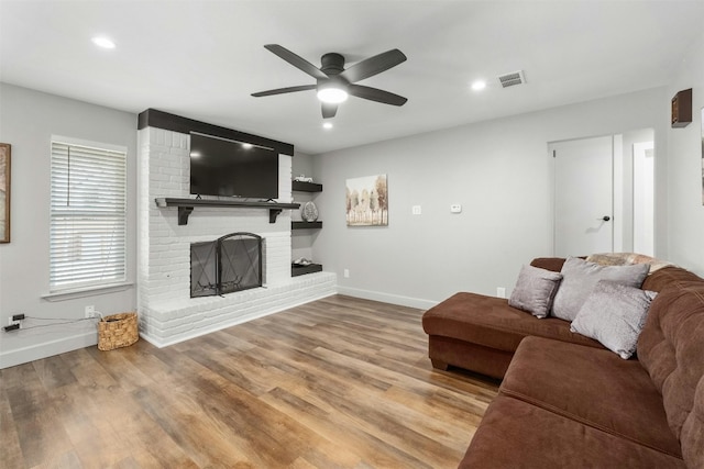 10113 Quail Hutch Dr, Austin, TX 78758 - living area with baseboards, ceiling fan, wood finished floors, a fireplace, and recessed lighting