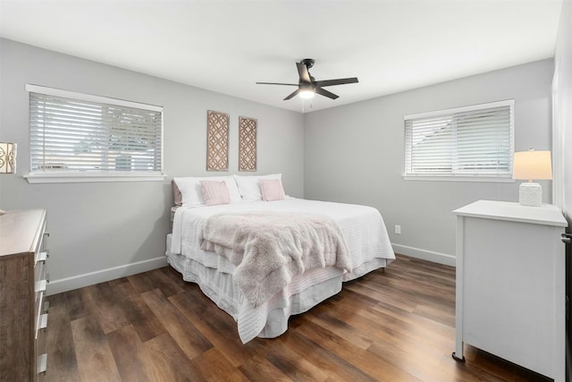 10113 Quail Hutch Dr, Austin, TX 78758 - bedroom featuring baseboards, dark wood-style flooring, and a ceiling fan
