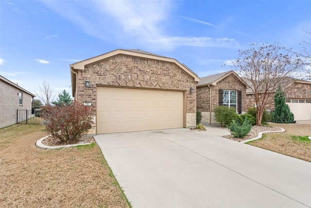 ranch-style house featuring a garage and a front yard