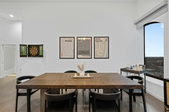 507 Sabine St Unit 907, Austin, TX 78701 - dining area with finished concrete flooring and recessed lighting