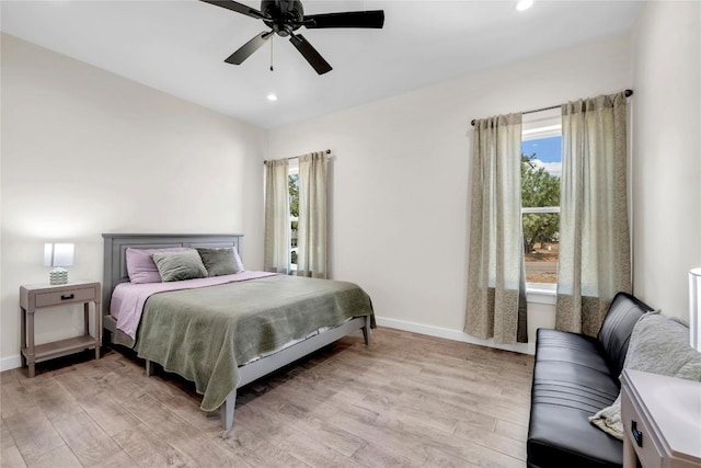 bedroom featuring a ceiling fan, light wood-type flooring, baseboards, and recessed lighting