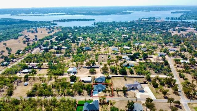 1514 Green Valley Ln, Granite Shoals, TX 78654 - aerial view of property and surrounding area with a nearby body of water and property parcel outlined