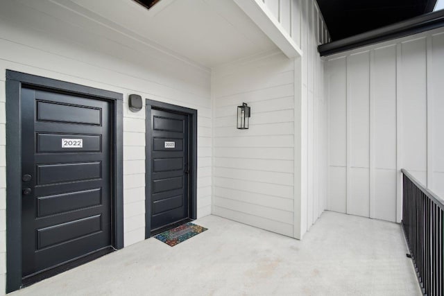 entrance to property featuring board and batten siding