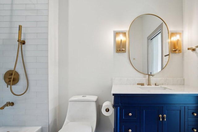 full bathroom with toilet, shower / bathing tub combination, and vanity