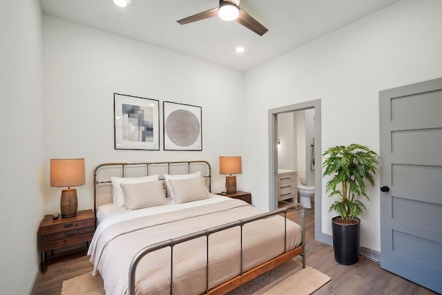 bedroom with baseboards, a ceiling fan, ensuite bath, wood finished floors, and recessed lighting