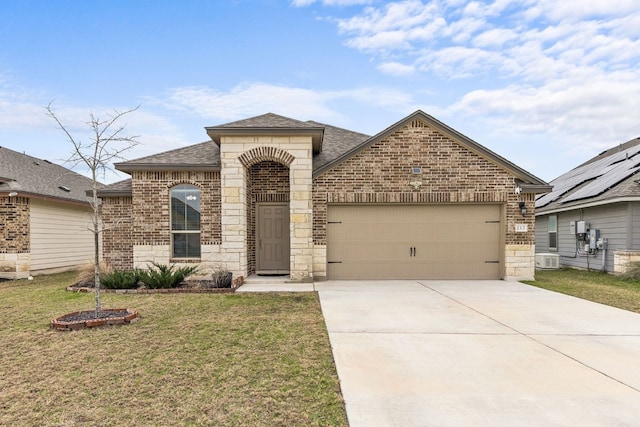 view of front of home with a garage and a front yard