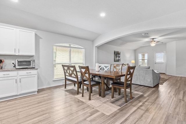 dining room featuring vaulted ceiling, ceiling fan, and light hardwood / wood-style floors