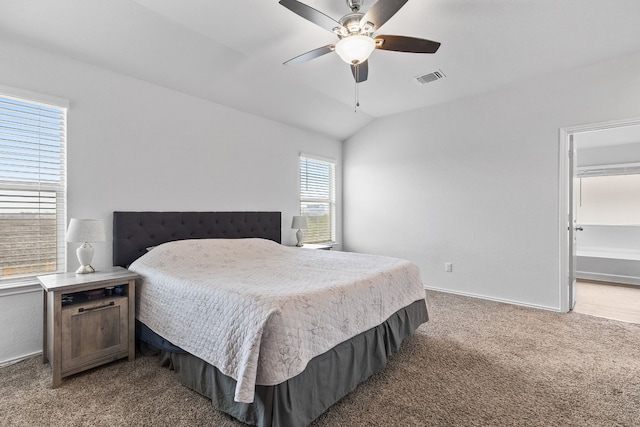 bedroom featuring lofted ceiling, ceiling fan, and carpet