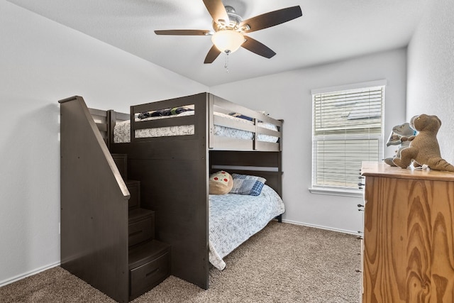 bedroom with ceiling fan and carpet flooring
