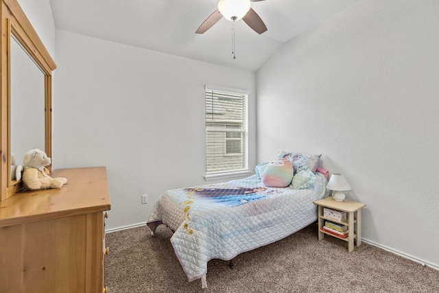 bedroom with vaulted ceiling, ceiling fan, and dark colored carpet