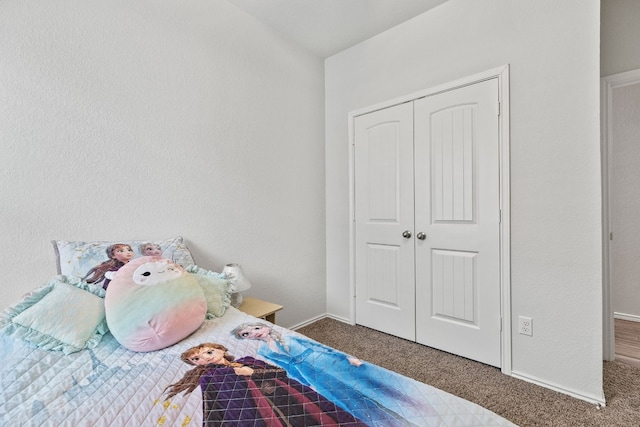 carpeted bedroom with a closet