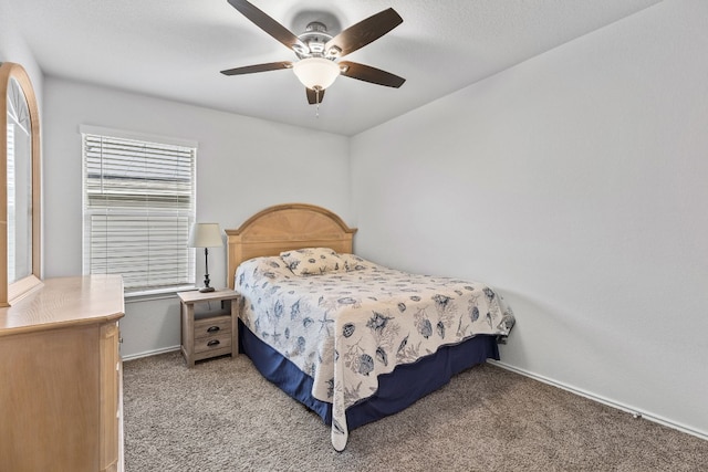bedroom featuring light colored carpet and ceiling fan