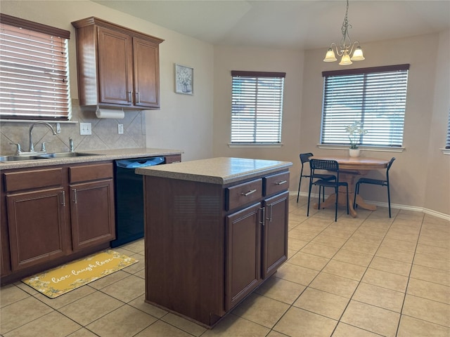 kitchen featuring sink, light tile patterned floors, black dishwasher, and a kitchen island