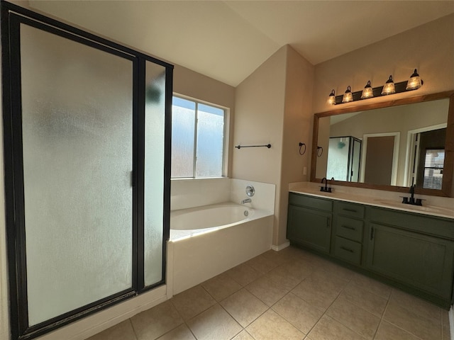 bathroom featuring tile patterned flooring, vanity, lofted ceiling, and independent shower and bath