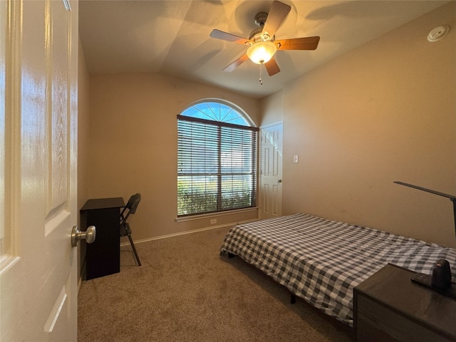 carpeted bedroom featuring lofted ceiling and ceiling fan