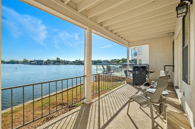 balcony featuring grilling area and a water view