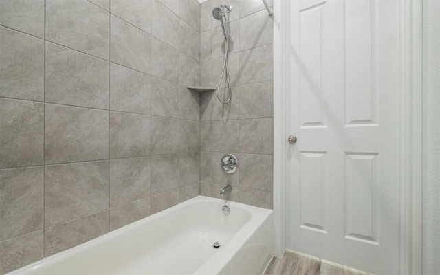 228 Citation Dr, Jarrell, TX 76537 - full bath with washtub / shower combination and wood finished floors